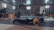 GIF of man doing a back clap push up