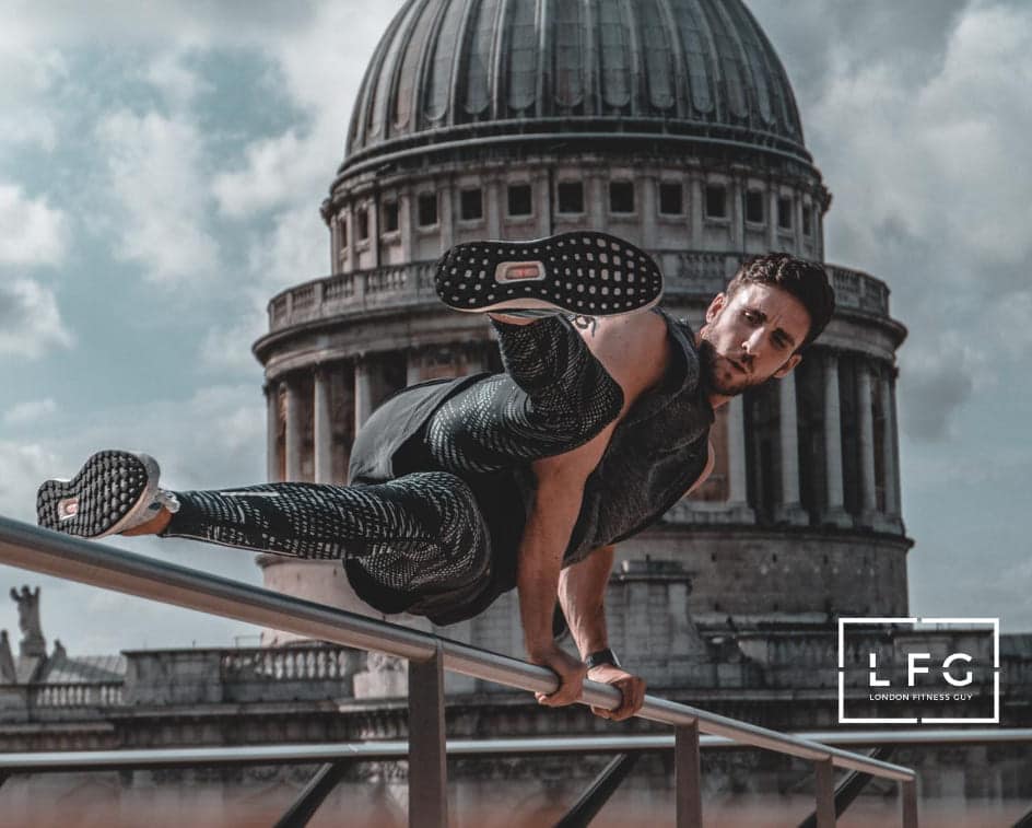 man balancing himself on a ledge