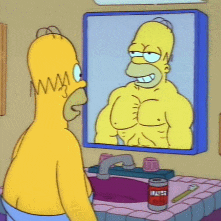 GIF of Homer Simpson looking in mirror and seeing himself as strong and muscular