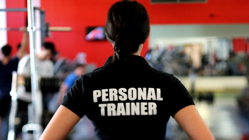 Personal Trainer wearing shirt that says "personal trainer"