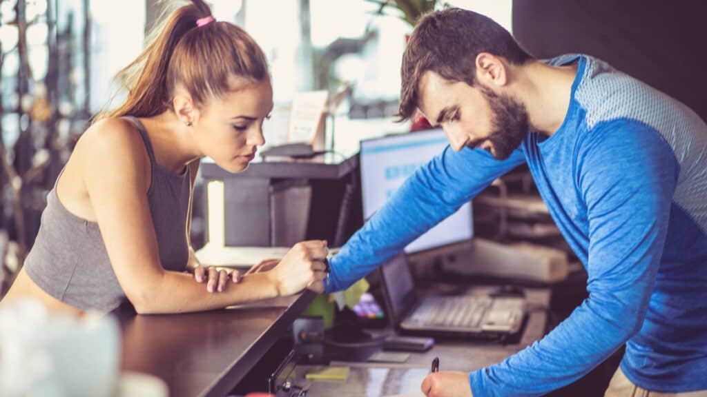 personal trainer charging client 